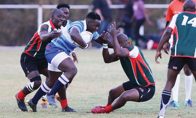 Gabs Hogs (in blue) defetaed BDF Cheetahs to retain the Botswana Super Rugby title PIC: KENNEDY RAMOKONE