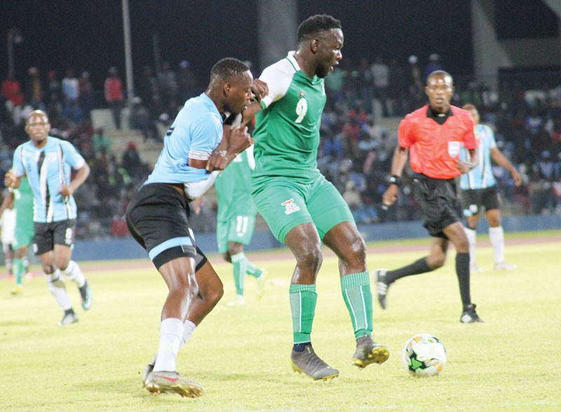 Zebras defender, Forunate Thulane battles for the ball with Zambian striker, Chitaya Musus 2-1 PIC: KEOAGILE BONANG