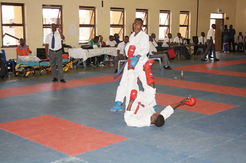A karate referee (left) during a local competition