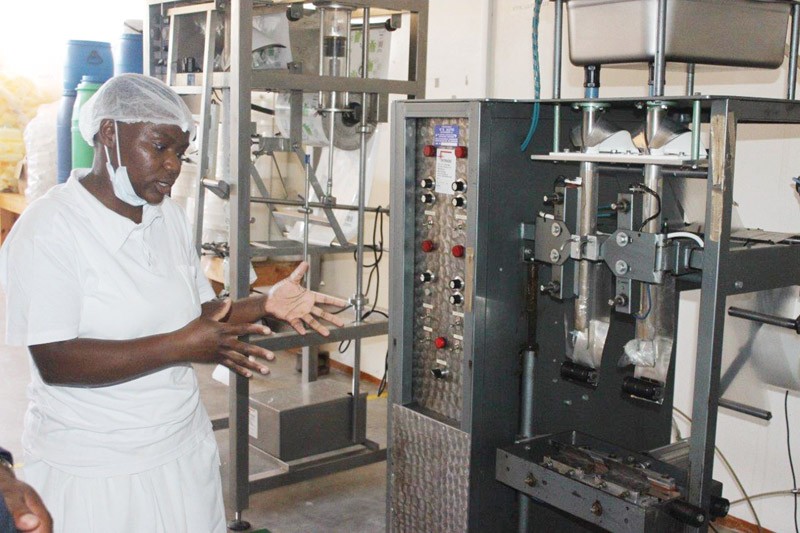 Dream Flavours employee showcasing their yogurt machinery
