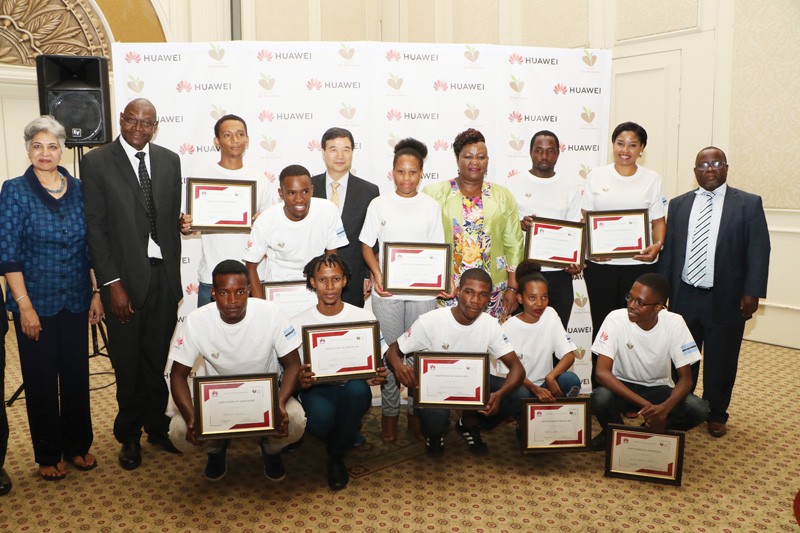 Winners of Huawei Seeds for the future posing for a picture with Ambassador of China to Botswana Mr Zhao Yanbo(forth at the back raw) and Minister of Transport and Communication Dorcus Makgato(green top).PIC: MORERI SEJAKGOMO