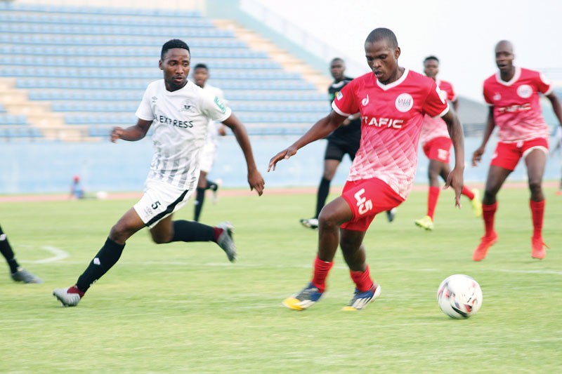 BR Highlanders defender, Mompati Oabile chasing him. PIC: KEAOGILE BONANG
