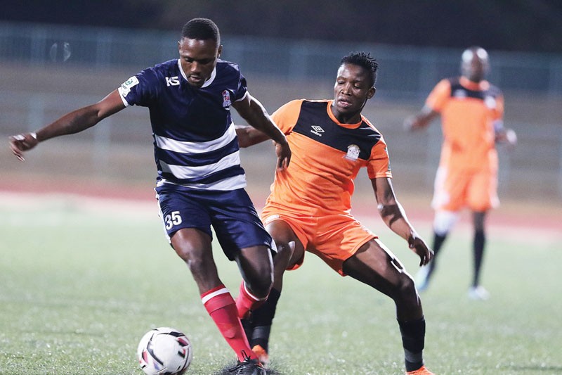 Botlhe Rakaki of Molepolole City Stars (left) fights for the ball with Orapa United's Mbatshi Elias. PIC: KENNEDY RAMOKONE