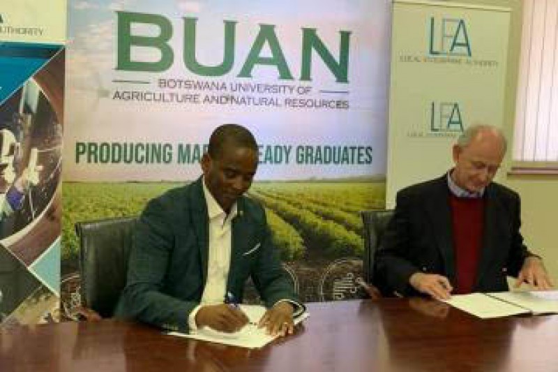 Hand in hand: LEA CEO Dr. Racious Moatshe and BUAN Vice Chancellor Dr. Jasper Rees signing the MoU