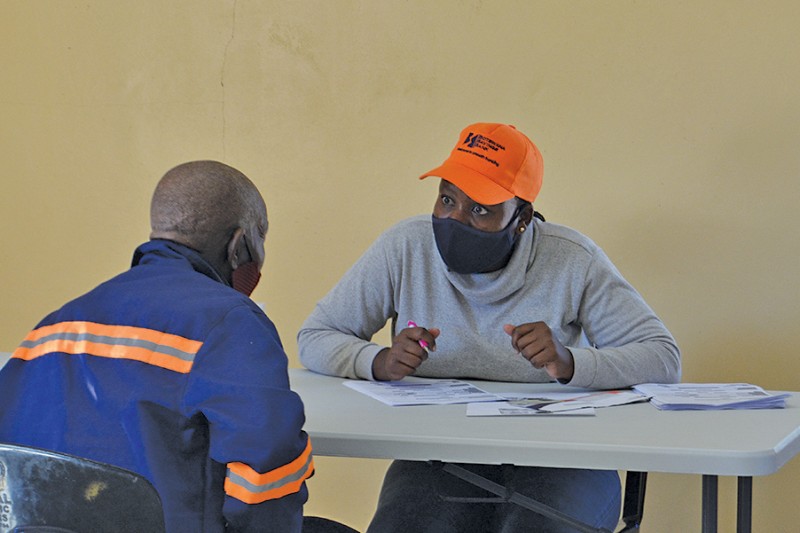 Reaching out: A social grant beneficiary goes through the the process to receive a VISA card